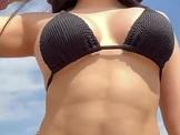 Latina Dances Over You on Beach