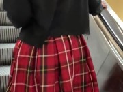 Fat ass going up mall escalator