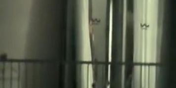 Peeping through hotel bedroom window