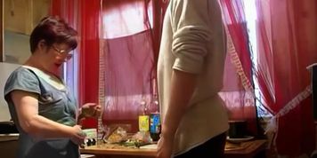 Russian mature mom Nyura with her son in the kitchen