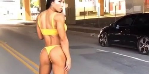 Gorgeous fitness girl Tina Nguyen posing in yellow bikini