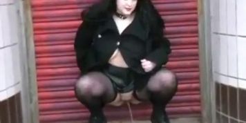 Chubby goth chick gets naked, pisses and masturbates in city centre streets