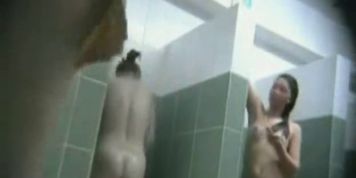 Cute chicks washing in public showers on hidden cam