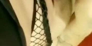 Goth girl in fishnets plays with her fat pussy