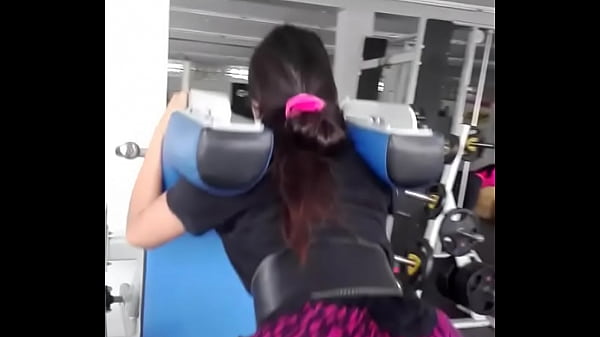 In the GYM exercising her ass